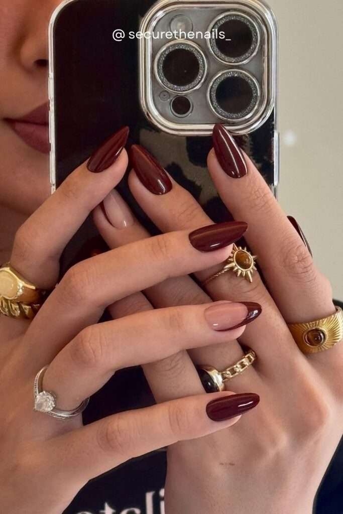 If there's one nail color that defines fall 2026, it's deep oxblood and dark burgundy. This almost-black red shade looks impossibly elegant on almond nails, and the high-gloss finish takes it to the next level.