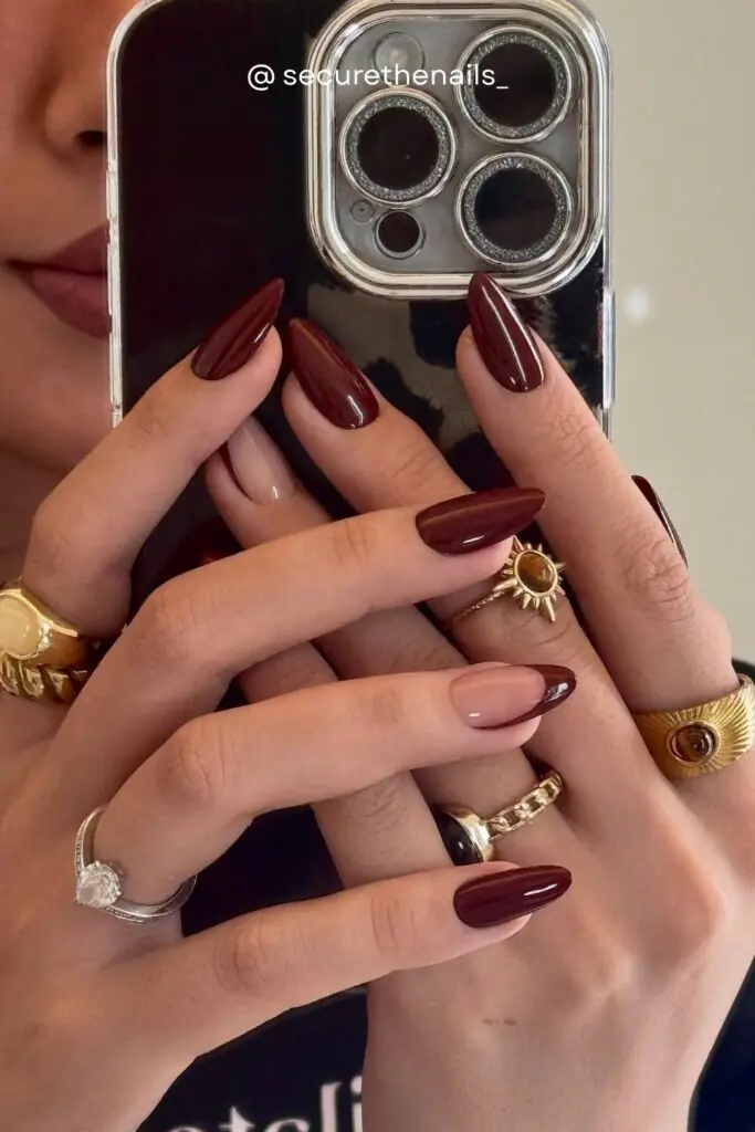 If there's one nail color that defines fall 2026, it's deep oxblood and dark burgundy. This almost-black red shade looks impossibly elegant on almond nails, and the high-gloss finish takes it to the next level.