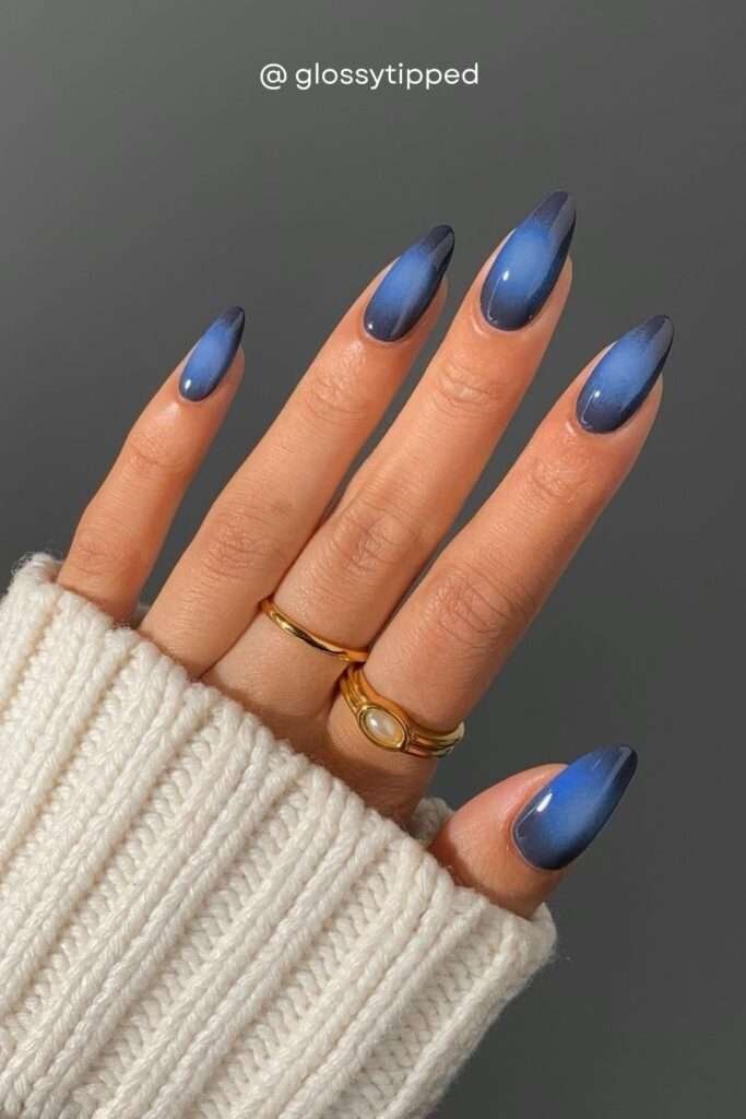 While browns and burgundies dominate fall 2026, midnight navy blue nails are the unexpected dark horse. Deep denim-to-navy cat eye nails feel perfectly autumnal — like the last blue sky before winter arrives.