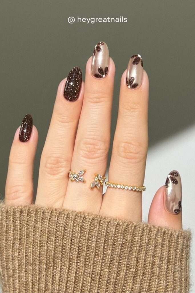 The brown chrome nail trend gets an autumn upgrade when mixed with abstract leopard spots. The combination of metallic champagne-brown chrome with dark espresso print accents is one of the most editorial fall nail looks of 2026.