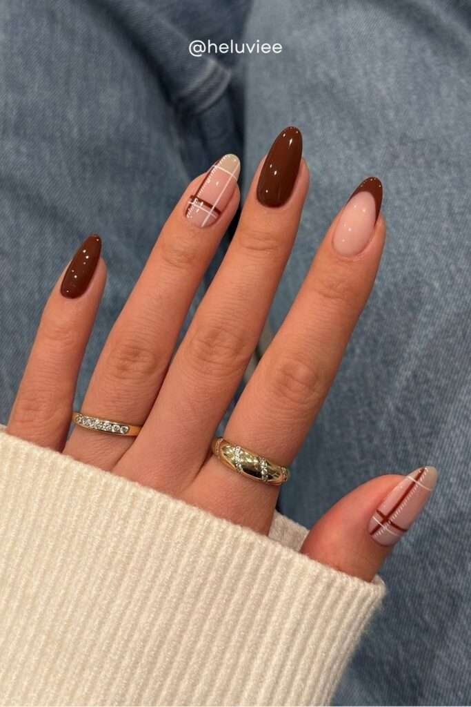 Nothing says autumn quite like plaid, and plaid nail art is one of the most on-trend fall designs for 2026. Whether it's a full tartan print or a subtle plaid accent nail on a brown base, these nails channel all the cozy flannel-and-pumpkin-spice energy of the season.