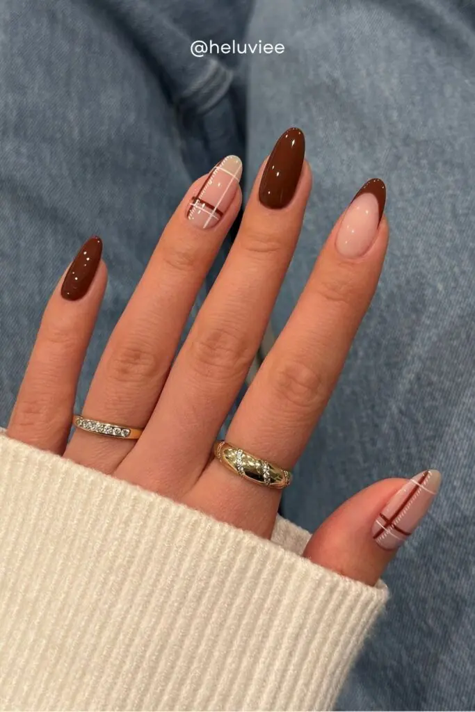 Nothing says autumn quite like plaid, and plaid nail art is one of the most on-trend fall designs for 2026. Whether it's a full tartan print or a subtle plaid accent nail on a brown base, these nails channel all the cozy flannel-and-pumpkin-spice energy of the season.
