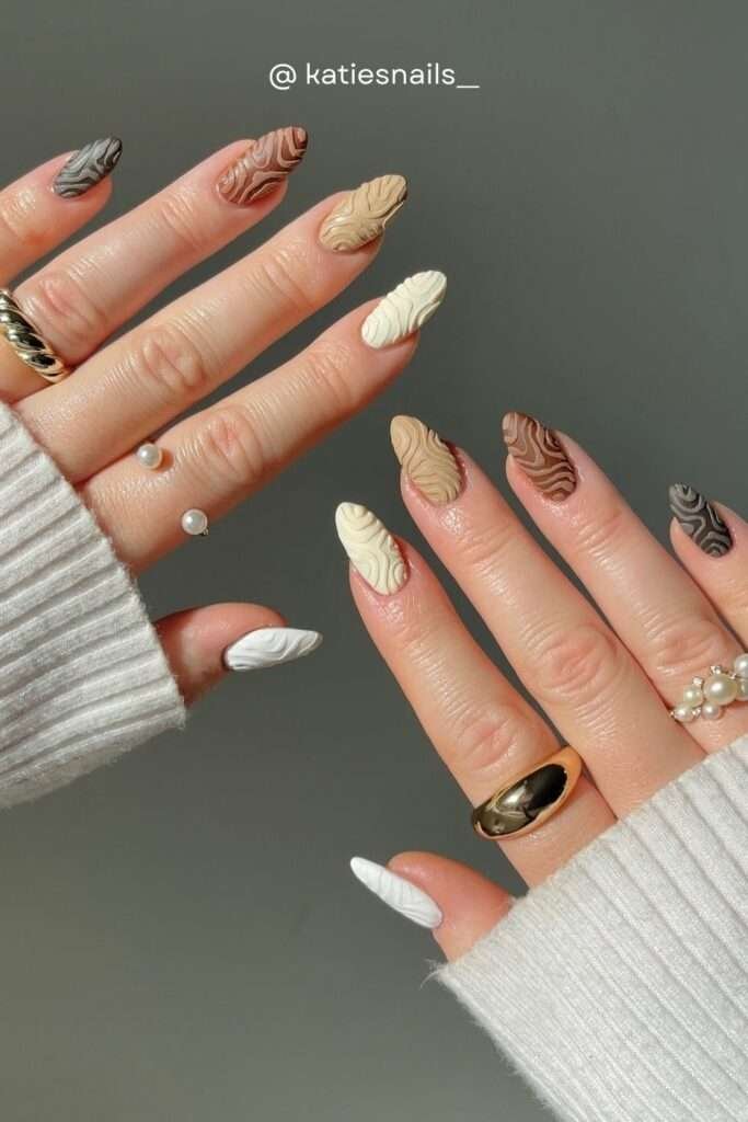 Fall 2026 is genuinely one of the richest, most exciting nail seasons in recent memory. Whether you're drawn to the timeless sophistication of a deep oxblood burgundy almond nail, the cozy warmth of chocolate brown with daisy art, the drama of tortoiseshell stilettos, or the playful sweetness of red bow nails — there is a fall nail look in this collection for every personality and occasion.