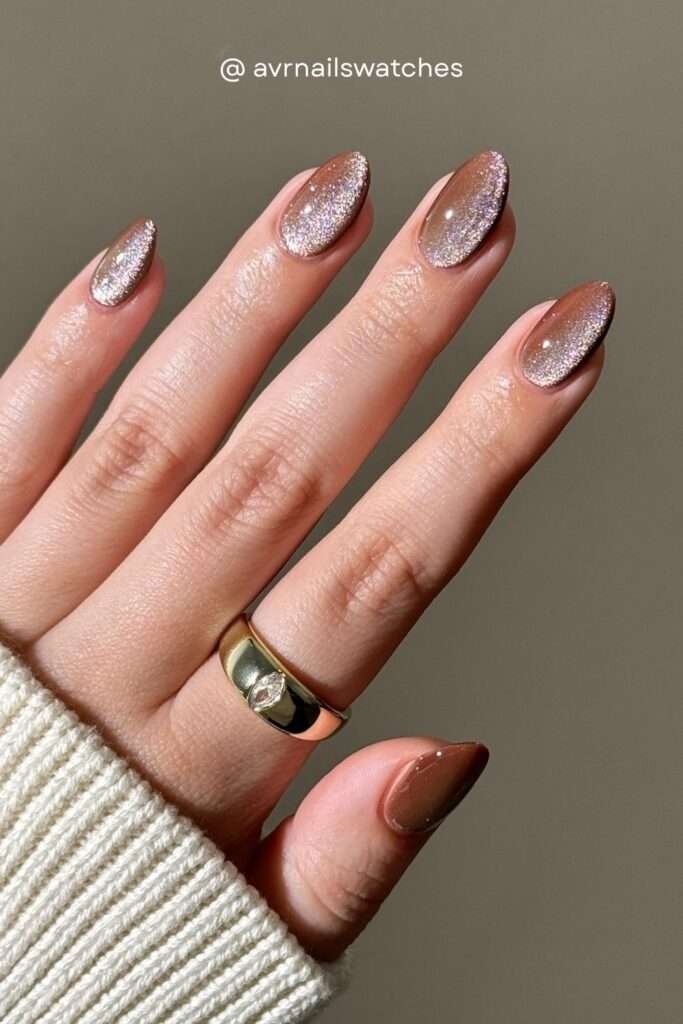 Glitter fall nails 2026 are all about layering fine shimmer over warm brown or rose gold bases for a look that catches every ray of autumn light. Think cozy sweater energy but make it sparkle.