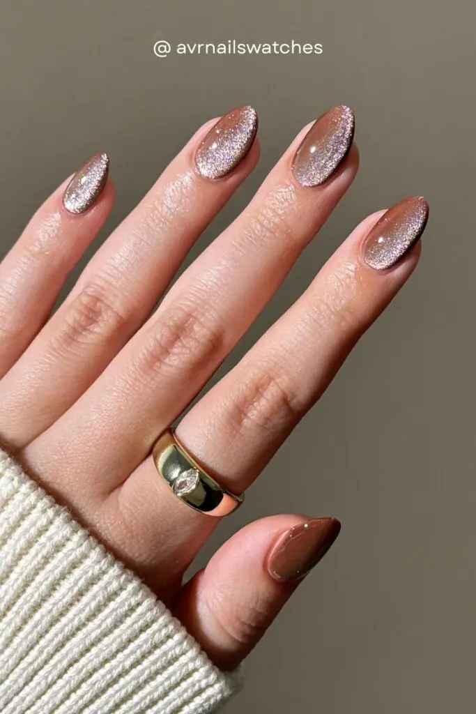 Glitter fall nails 2026 are all about layering fine shimmer over warm brown or rose gold bases for a look that catches every ray of autumn light. Think cozy sweater energy but make it sparkle.