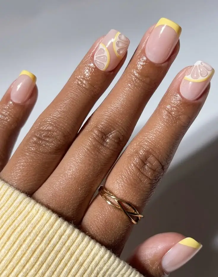 Brighten up your summer feed with this playful yet meticulous design featuring crisp pastel yellow tips and ultra-realistic 3D lemon slice nail art. The immaculate square shape and glossy, sheer base keep the vibrant fruit motifs looking elevated and intentionally structured rather than kitschy. It strikes the perfect balance for July, offering a refreshing.