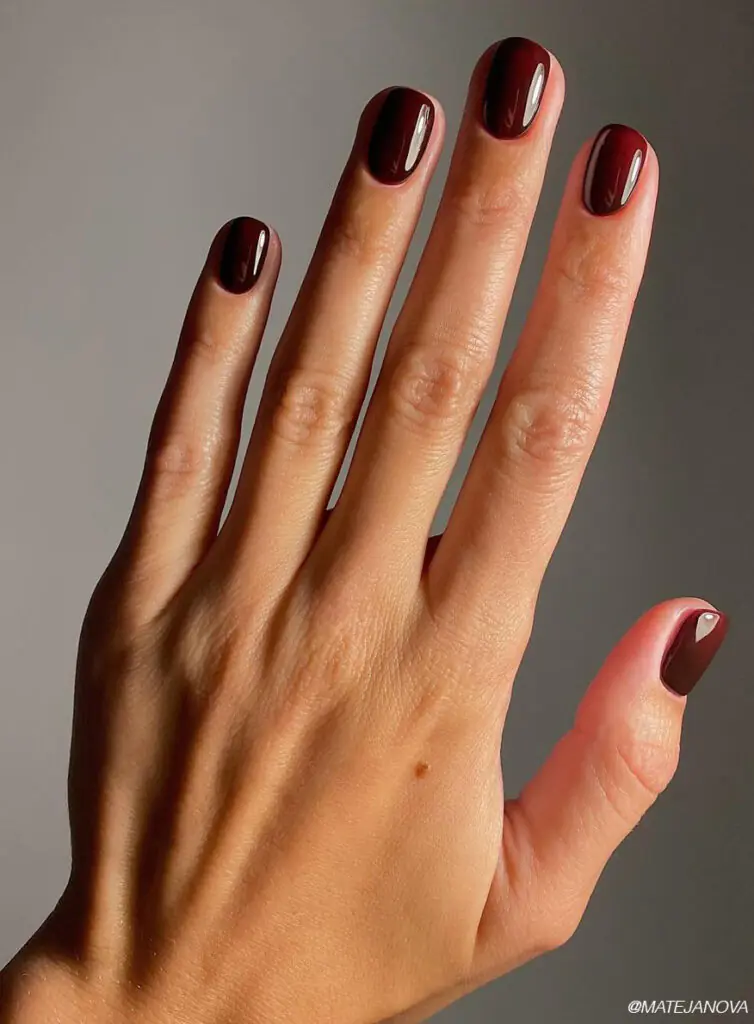 Deep burgundy is the kind of color that instantly makes your hands look more put together. It has just enough red undertone to feel festive without veering into full holiday territory too early in the season.