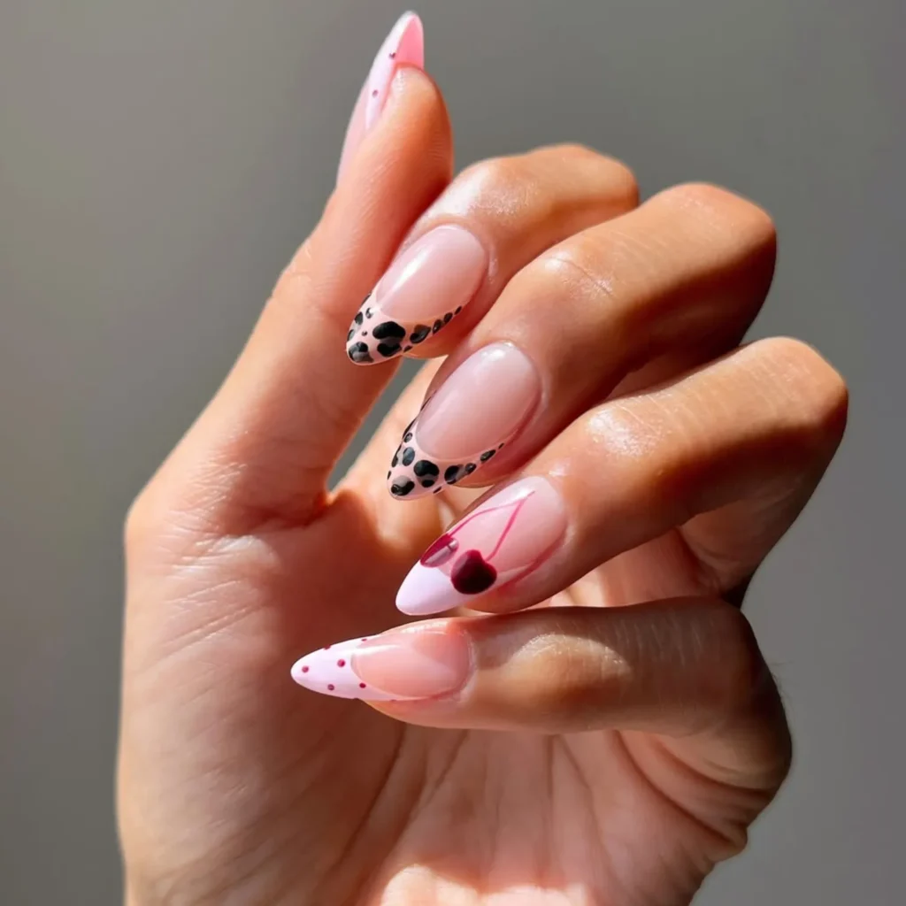 Cherry nail art with black spotted French tips August 2026 manicure trend