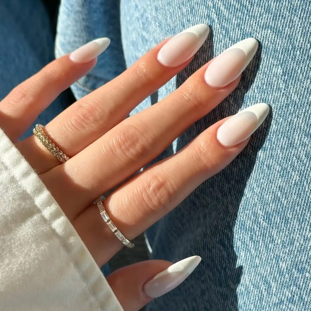Creamy white French tip almond nails trending for August 2026 manicure ideas
