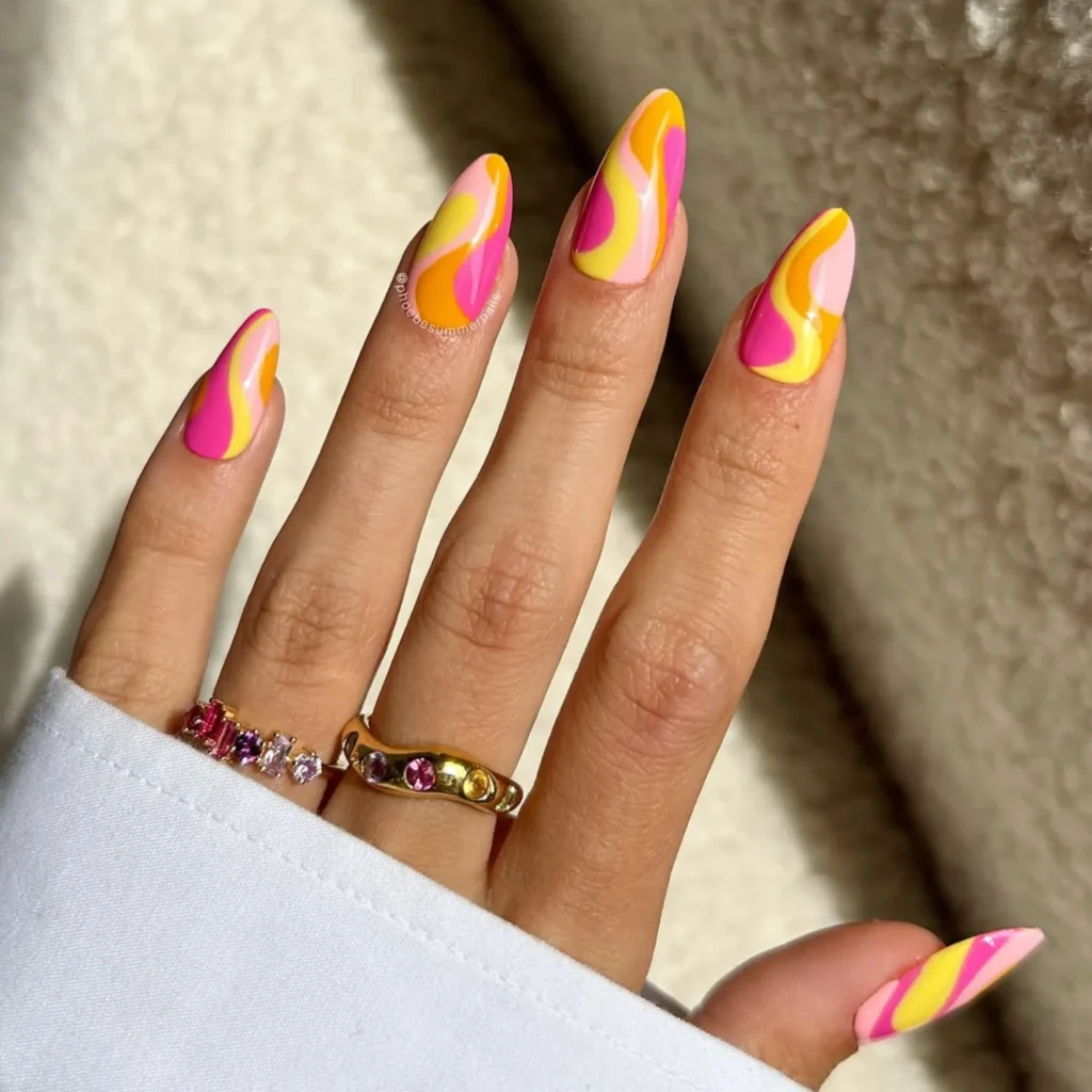 Pink yellow and orange swirl nails trending for August 2026 summer nail designs