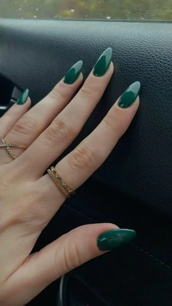 Forest green nails bring a little bit of drama without feeling costume-y or over the top. This shade pairs beautifully with gold accents and looks especially rich in a cream or satin finish rather than high gloss, which can sometimes read as too bright for the deep tone.
