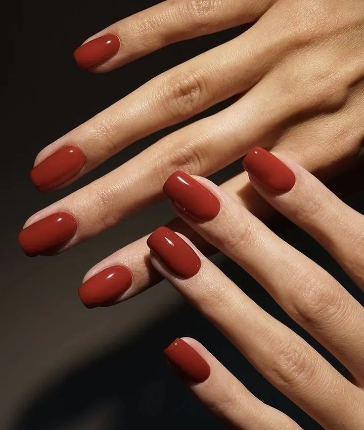 Rust red is bolder than terracotta and warmer than burgundy, landing in this perfect in-between zone that feels distinctly autumn. It's an easy way to add color to your manicure without straying from a fall-appropriate palette, and it looks incredible against tan or olive skin tones especially.