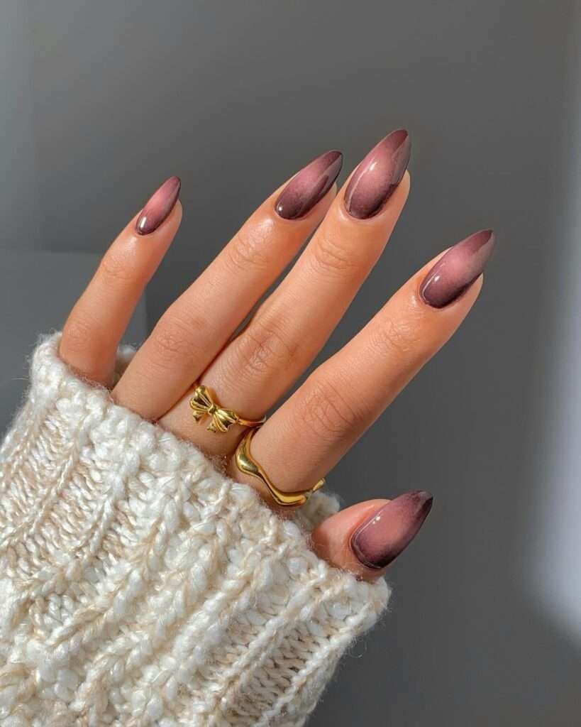 Not every October nail idea needs pumpkins or ghosts. A smoky mauve cat-eye captures the mood of the season through color and light: plum at the edges, a soft magnetic glow through the center, and a glassy finish that catches every candlelit angle. It feels feminine, a little mysterious, and easy to wear long after Halloween.