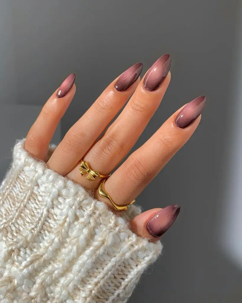 Not every October nail idea needs pumpkins or ghosts. A smoky mauve cat-eye captures the mood of the season through color and light: plum at the edges, a soft magnetic glow through the center, and a glassy finish that catches every candlelit angle. It feels feminine, a little mysterious, and easy to wear long after Halloween.