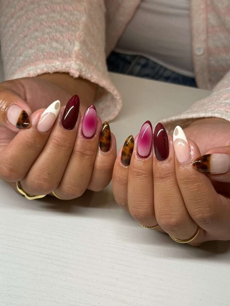 Merlot and Blush Mix-and-Match. If you cannot decide between a nude manicure and a dark fall shade, you do not have to choose. Pair blush pink with merlot, burgundy, and a glossy accent nail for a set that feels both romantic and seasonal. I love how this color story flatters gold rings and looks polished with everything from denim to satin.