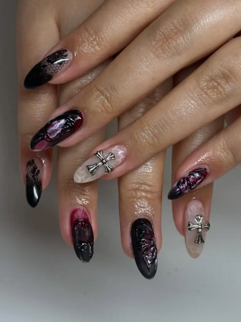This is the manicure I picture with black boots, a leather jacket, and a late dinner reservation. Garnet, black, and glitter create a rich gothic mood without relying on literal Halloween symbols. The mix of reflective finishes keeps the darker palette dimensional and gives every nail a different flash when you move your hands.