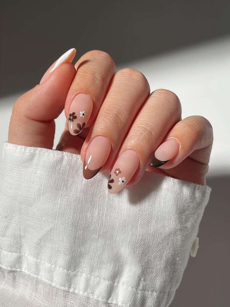 Blush Bow Minimal Nails. There is something lovely about a manicure that whispers instead of shouts. A sheer blush base, a burgundy tip, and tiny bow details create a soft romantic look that still feels right for October. I would recommend this when you want your nails to look finished and special, but you do not want them to be the first thing people notice.