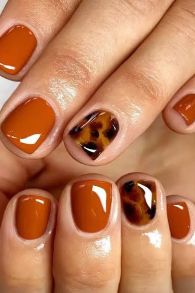 I know orange nails are often associated with October and Halloween, but burnt orange deserves a place in your November manicure rotation, too. The trick is choosing the right shade. Instead of bright pumpkin orange, look for something deeper and more muted, with hints of rust, terracotta, or warm brown. These earthy undertones make burnt orange feel far more sophisticated and wearable as autumn moves toward winter.