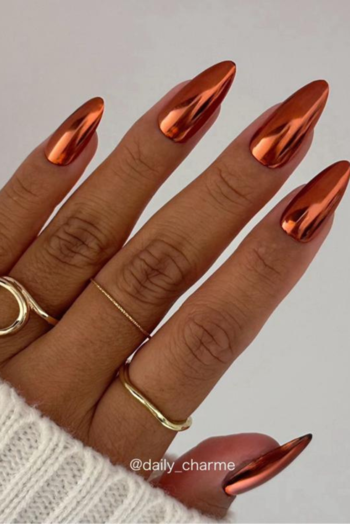 If you're in the mood for something a little more eye-catching this November, copper chrome nails might be the answer. They combine the warmth of autumn with the reflective finish of a metallic manicure, creating a look that's rich, modern, and surprisingly wearable. Unlike cool silver chrome, copper has warm orange, bronze, and reddish-brown undertones.