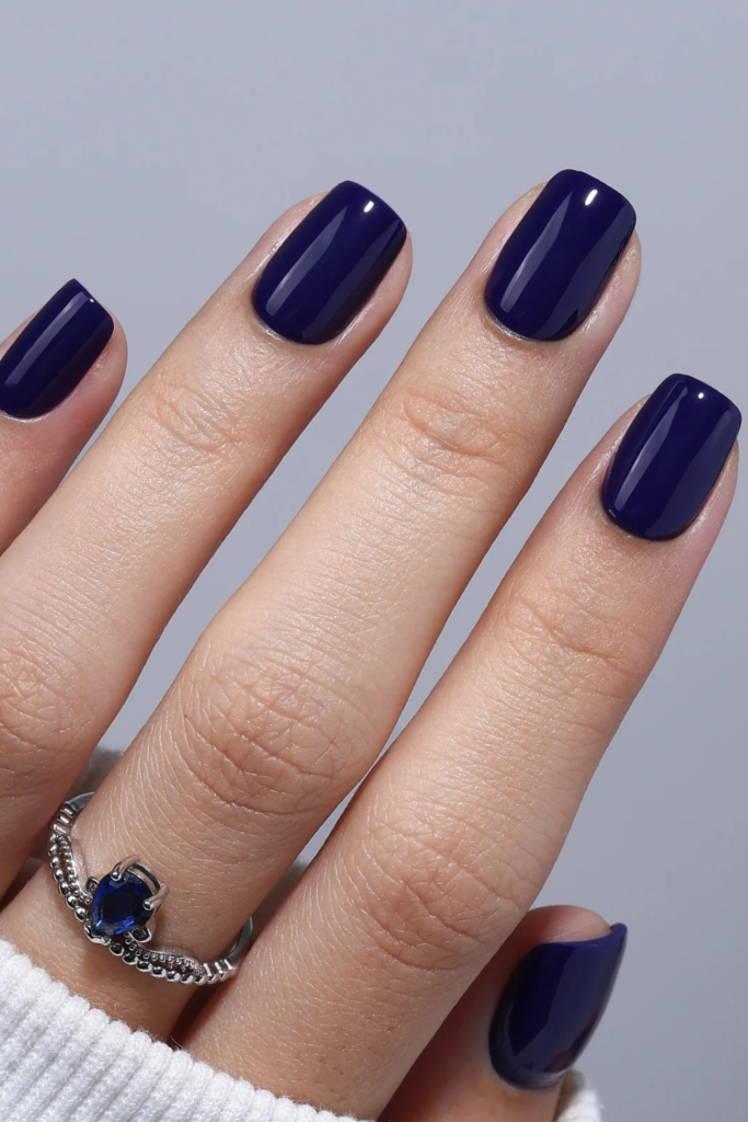If you've been wearing burgundy and brown for most of autumn, midnight blue offers a refreshing change without losing that moody seasonal atmosphere. This deep navy shade has a richness that can look almost black indoors, but its blue undertones become noticeable when your nails catch the light. I particularly like midnight blue because it feels sophisticated without relying on the warm colors we usually associate with November.