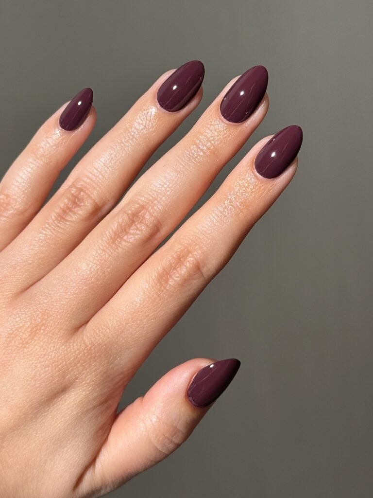 If you only change one thing about your manicure this month, make it this. A plum with a touch of brown in it looks softer than black and more interesting than a classic red, and it works with a work blazer just as easily as a weekend sweater.