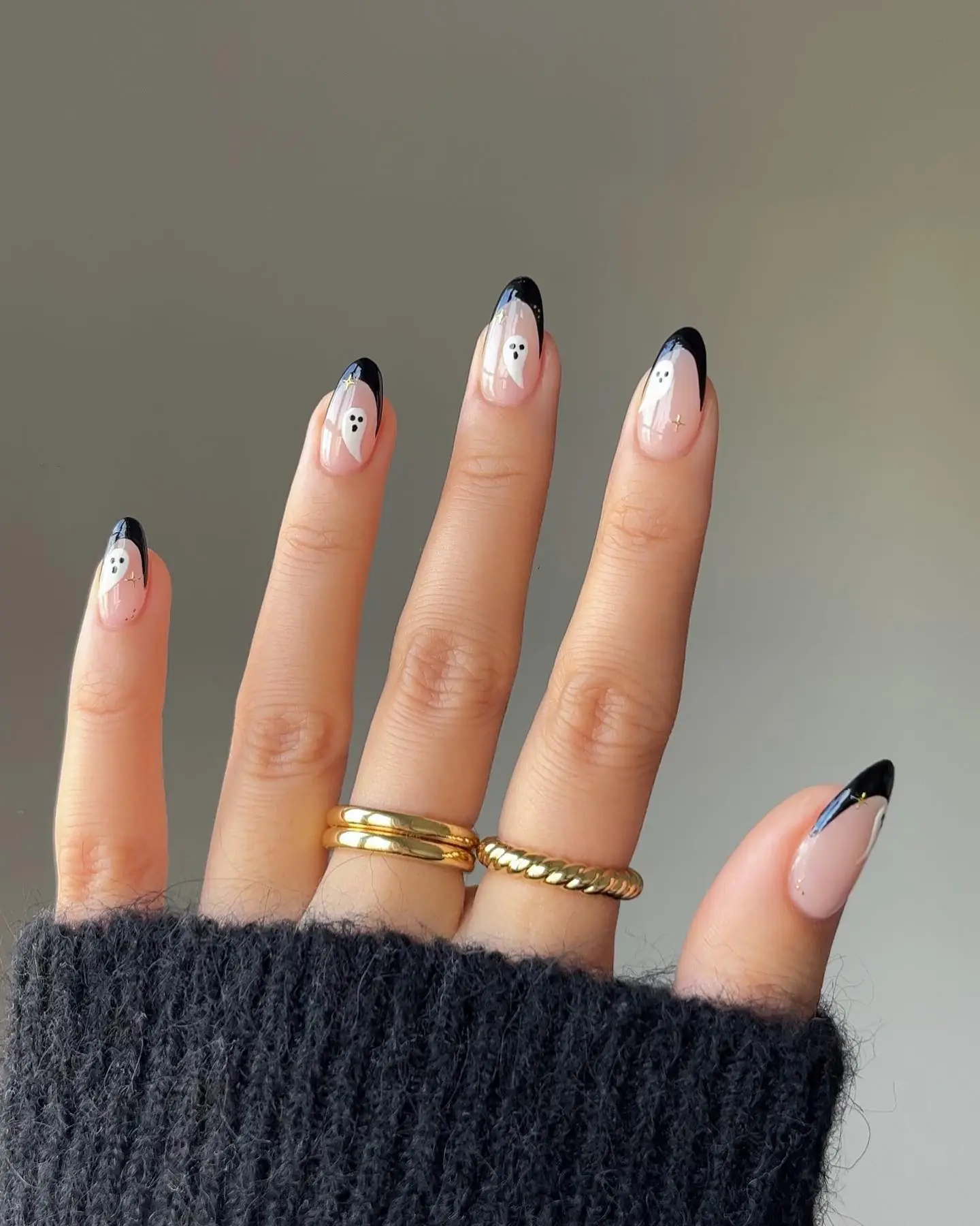 A black French edge already feels a little mysterious; add a tiny ghost and it becomes a wearable Halloween classic. The nude base keeps the design airy, while the dark tips frame short nails beautifully. It works at a Halloween party and still looks right with a blazer on Tuesday.